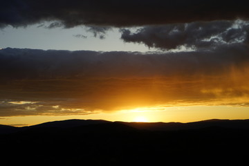 Sunset Over Mountains with Clouds