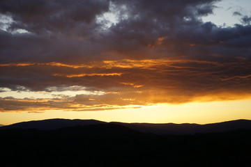 Brilliant Sunset with Clouds Over Mountains