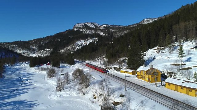 AERIAL. Train Oslo - Bergen in mountains. Hordaland, Norway.