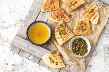 Pita bread sandwiches and grilled with olive oil and zatar.Top view