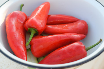 Red sweet pepper lies in a bowl