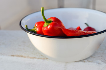 Red sweet pepper lies in a bowl