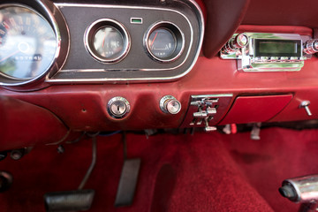 Interior view with instruments of an old red car