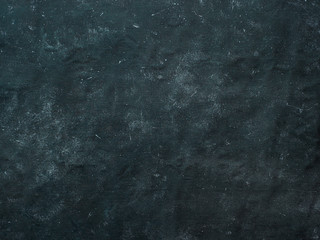 Dark mottled rustic background. Black blue canvas backdrop for design. Natural linen colored black blue dirty canvas fabric background or texture.