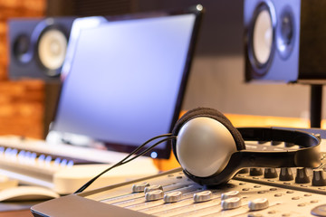 headphone on mixing console in recording studio