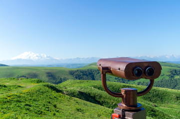 summer day and a pair of binoculars to see the panorama of the mountains