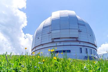 Fototapeta premium Large azimuth telescope in the mountains of Arkhyz on a Sunny summer day