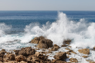 Powerful waves splashing on a rocky beach of Cyprus