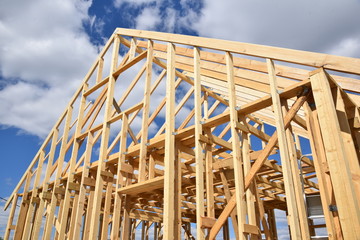 Wood frame residential building under construction.Building construction, wood framing structure at...