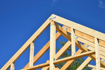 Wood frame residential building under construction.Building construction, wood framing structure at...