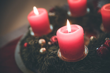 Traditional Christmas decoration: Advent wreath with red lights