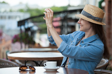 Young woman in a street cafe