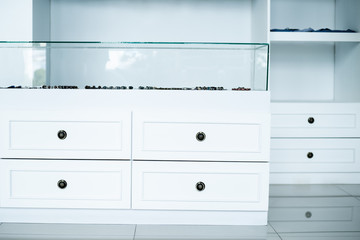white wardrobe chest of drawers, interior dressing room, store
