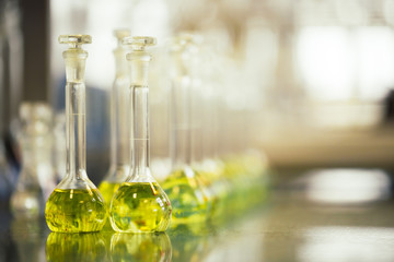 Flasks with liquids in a lab, pharmaceutical industry factory and production laboratory, chemistry concept