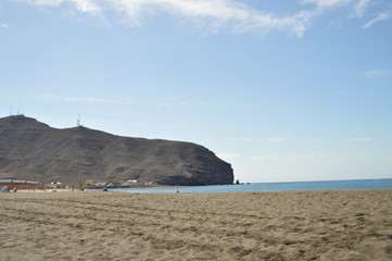 Fototapeta na wymiar Wonderful Black Sand Beach On A Sunny Day In The Great Tarajal. July 4, 2013. Gran Tarajal Tuineje Fuerteventura Canary Islands. Nature Vacation
