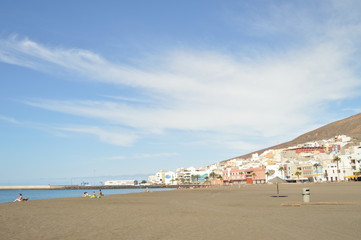 Views Of The Village From The Wonderful Black Sand Beach On A Sunny Day In The Great Tarajal. July 4, 2013. Gran Tarajal Tuineje Fuerteventura Canary Islands. Nature Vacation