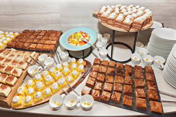 Assortment, variety of sweet cakes on candy buffet