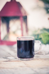 Enjoying Christmas time on the Christmas market. Close up of a cup of mulled wine.