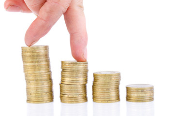 fingers step on a stack of coins. Business growth chart.