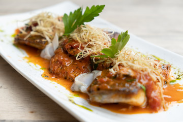close up of pan seared sea baas snapper fish mediterranean style