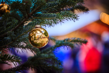 Magical Christmas market: Decoration with Christmas bauble on a fir branch.