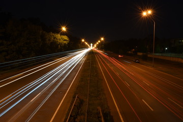 Evening traffic streaks by on a highway