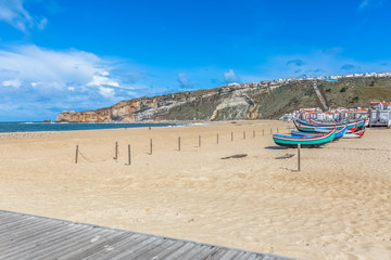 Nazare / Portugal - 04 05 2019 : View at the Nazare beach with of colored and traditional fishing...