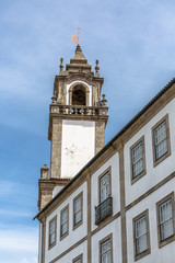 Fototapeta na wymiar Viseu / Portugal - 04 16 2019 : View of a tower at the Church of Mercy, baroque style monument, architectural icon of the city of Viseu, in Portugal