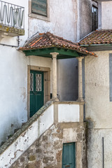 Fototapeta na wymiar View at a classic traditional urban buildings on Viseu city Downtown, Portugal
