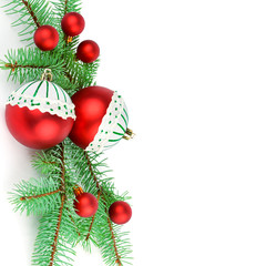 Sprigs of fir and bright Christmas decorations isolated on white background. Free space for your text.