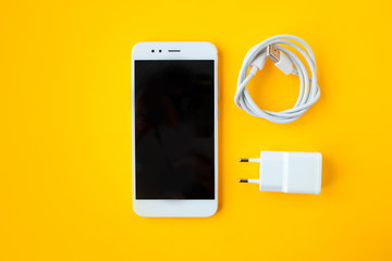 Mobile kit with smartphone and the chargers.
