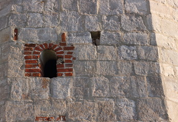 Medieval wall from white limestone with small embrasure Arsenal Corner Tower of the Zaraysk Kremlin