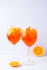Aperol Spritz cocktail with mint leaves on a white background. Italian cocktail aperol spritz on white
