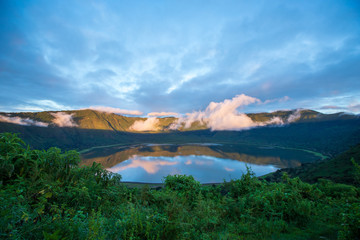 aerial view of mountains, lake and clouse during sunrise