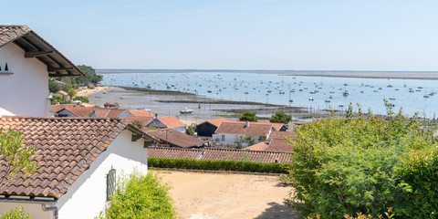 view over the basin Cap Ferret Arcachon in french village Le Canon in web banner template