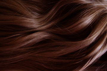 Beautiful hair. Long curly red hair. Staining in dark red.