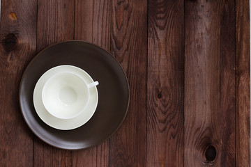 dish saucer cup stacked on a dark background