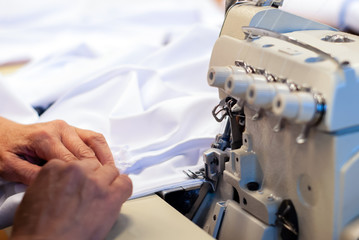industrial overlock sewing machine in work