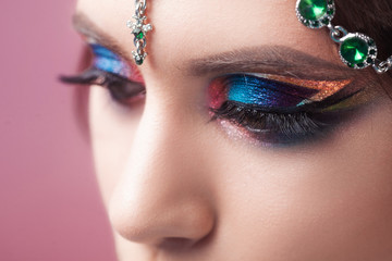 Bright eye makeup, glamorous makeup in Oriental style, glamorous fashion image