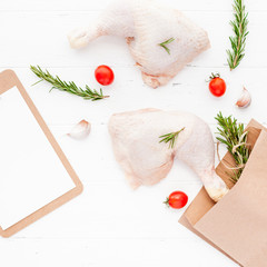 Fresh raw chicken legs with herbs. Cooking concept