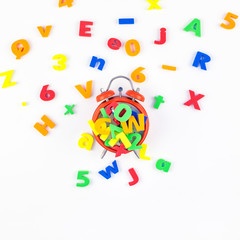 Alarm clock and multicolor alphabet