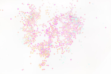 Pearl pastel confetti sparkles on white background