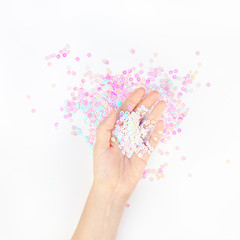 Pearl pastel confetti sparkles with woman hand