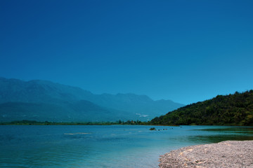 view of the mountains in montenegro coastal sea with blue sky