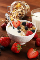 Cereal. Bowl of granola cereals, fruits and milk for breakfast. Muesli with cereals.