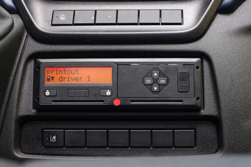 Digital tachograph display reads Printout Driver 1. No personal data. Tachograph in a van