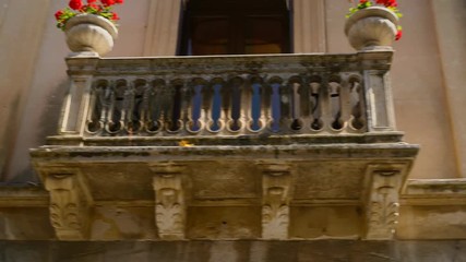 Amazing details of popular cozy Taorina decorate houses, sunny street of Sicily