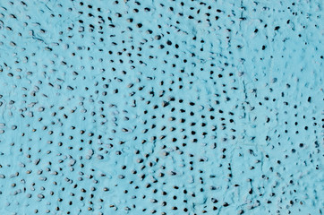 Texture concrete turquoise wall with holes