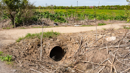iron drain pipe through ditch