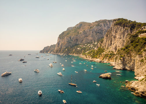 Aerial view of boats gathered in the sea off Capri, Bay of Naples, during summer, Southern Italy.